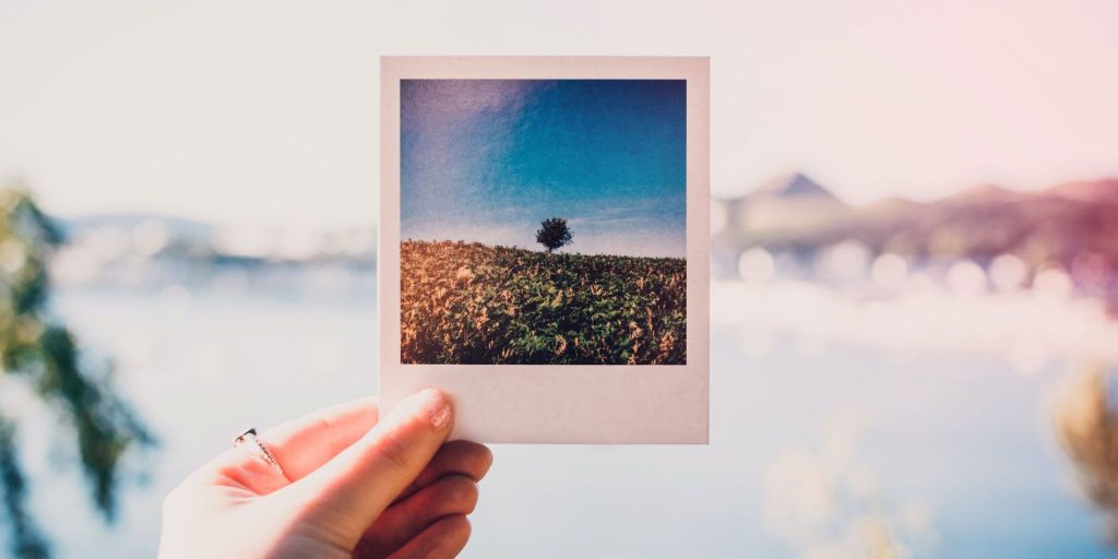 hand holding polaroid photo