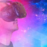 man using VR goggles with multicolor background