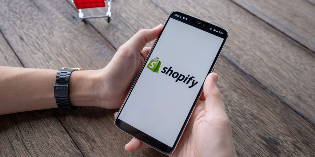 Man-opening-shopify-app