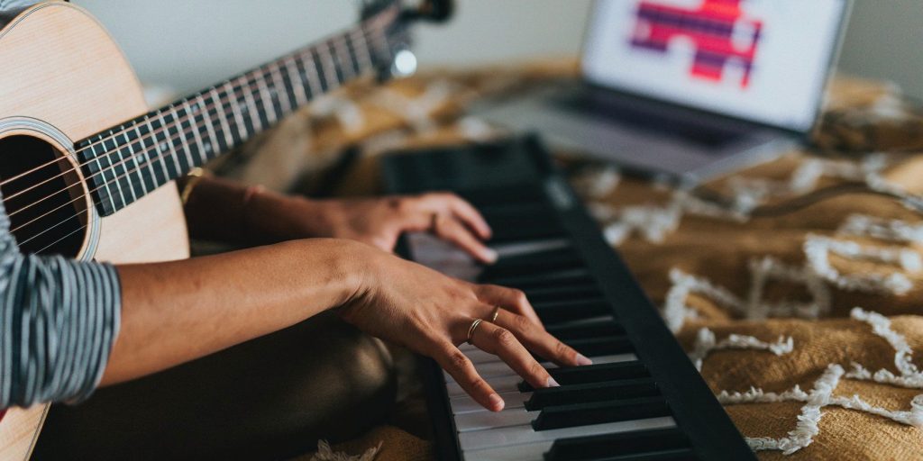 Person Playing Keyboard